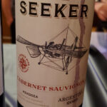 A wine bottle: Seeker Cab Sauv Mendoza Argentina