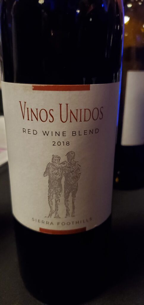 A wine bottle: Vinos Unidos Red Wine Blend Sierra Foothills